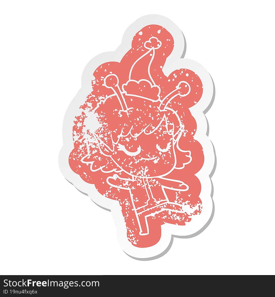 Smiling Alien Girl Cartoon Distressed Sticker Of A Wearing Santa Hat