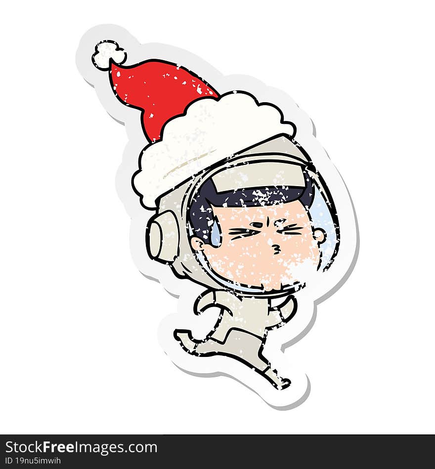 distressed sticker cartoon of a stressed astronaut wearing santa hat