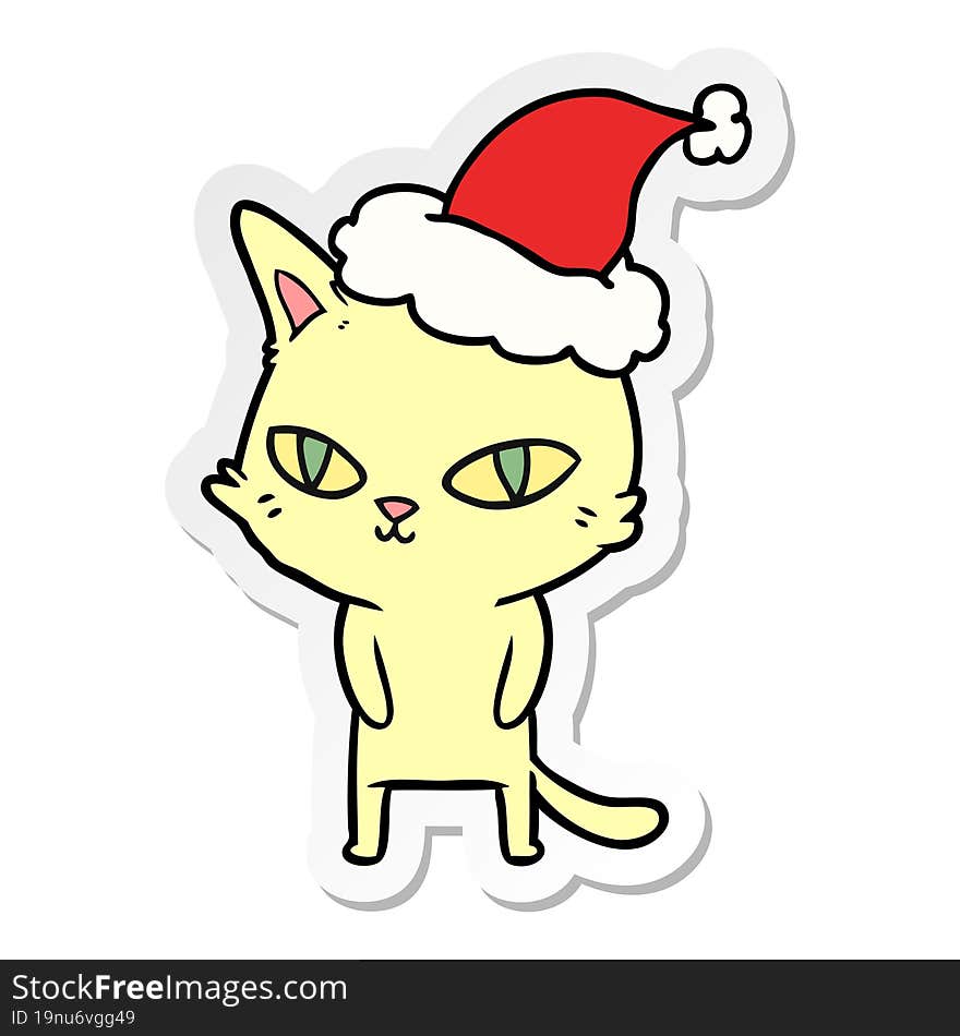 sticker cartoon of a cat with bright eyes wearing santa hat