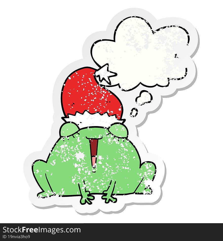 cute cartoon christmas frog and thought bubble as a distressed worn sticker