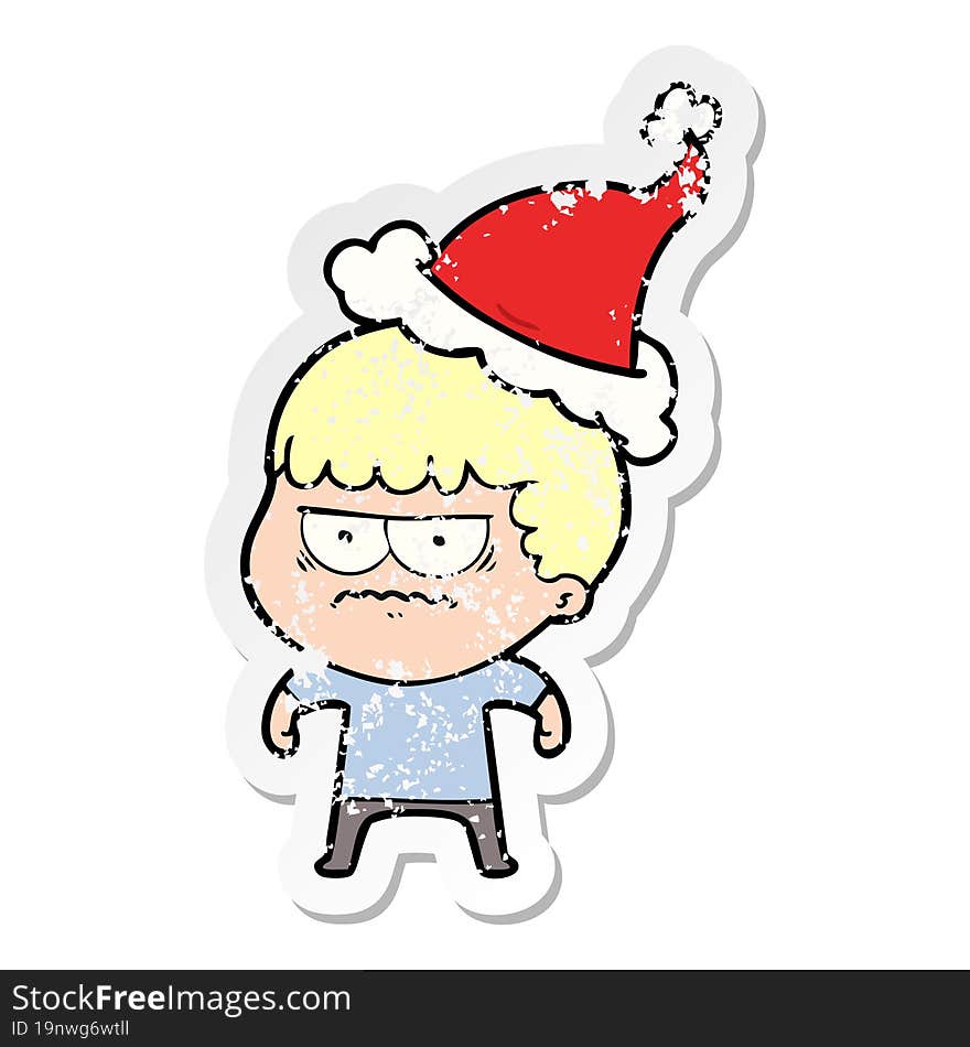 distressed sticker cartoon of a annoyed man wearing santa hat