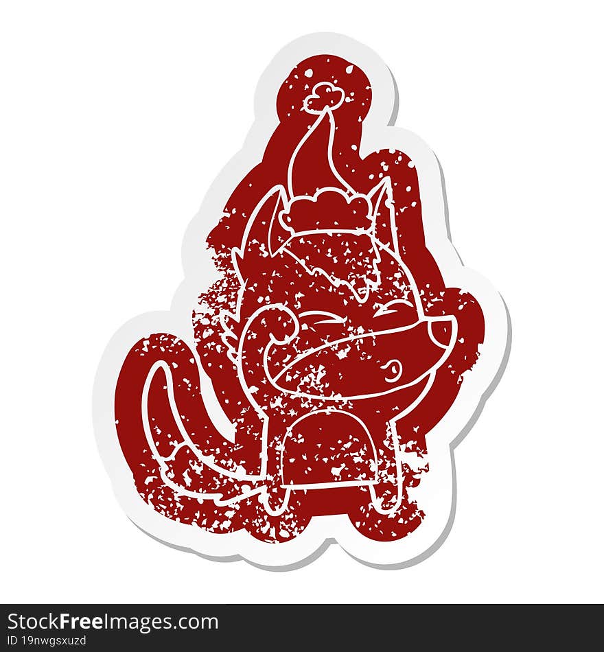 cartoon distressed sticker of a wolf pouting wearing santa hat