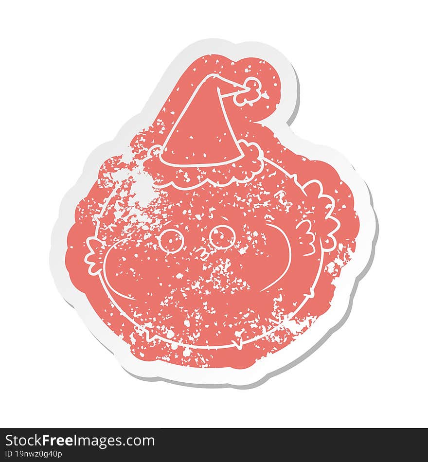 cartoon distressed sticker of a puffer fish wearing santa hat