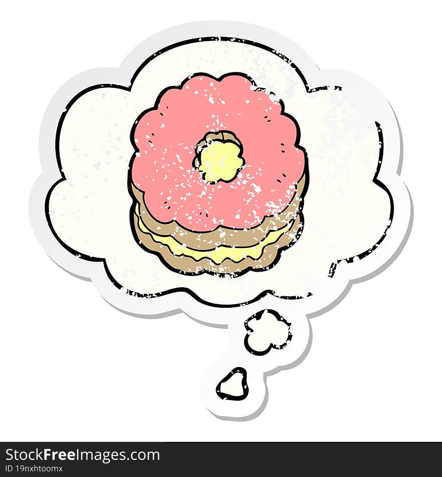 cartoon biscuit with thought bubble as a distressed worn sticker