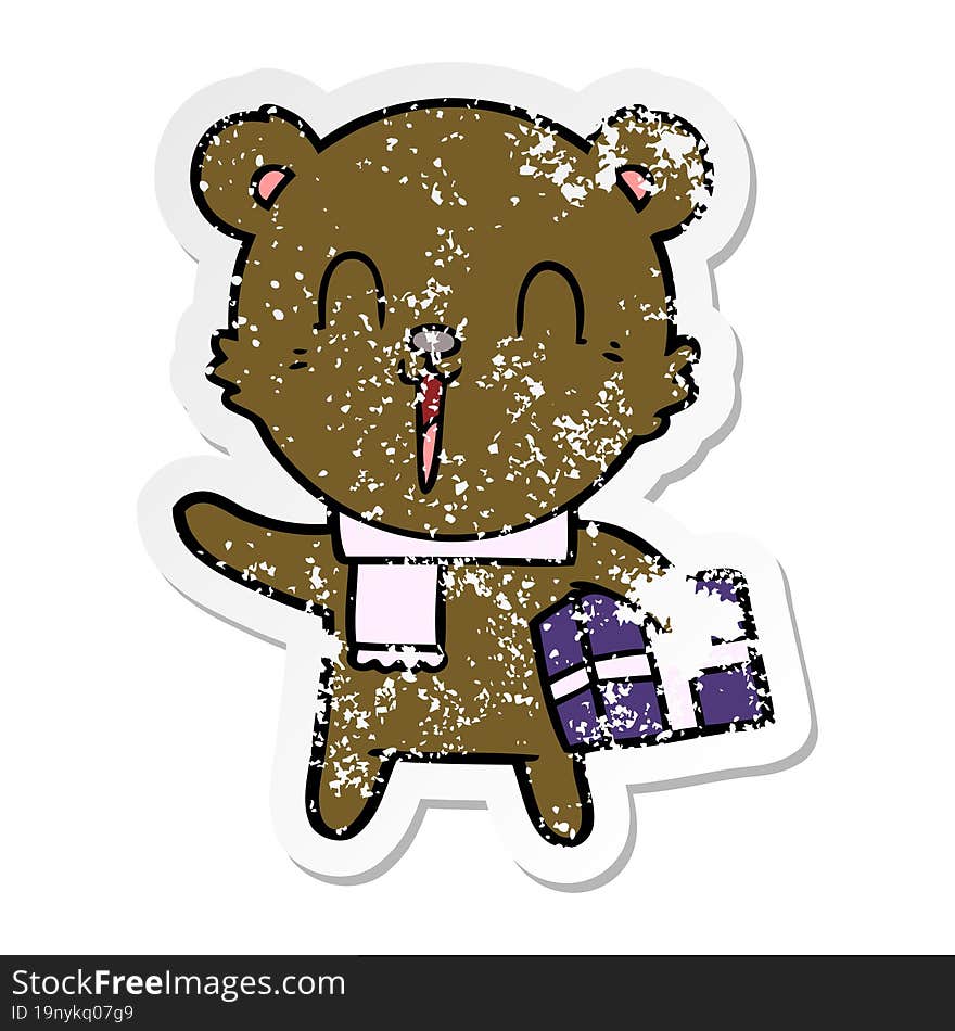 distressed sticker of a happy cartoon bear with gift