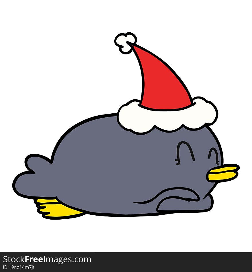 penguin lying on belly wearing santa hat