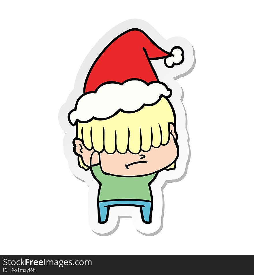 sticker cartoon of a boy with untidy hair wearing santa hat