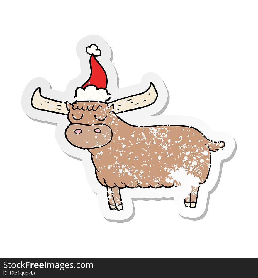 hand drawn distressed sticker cartoon of a bull wearing santa hat