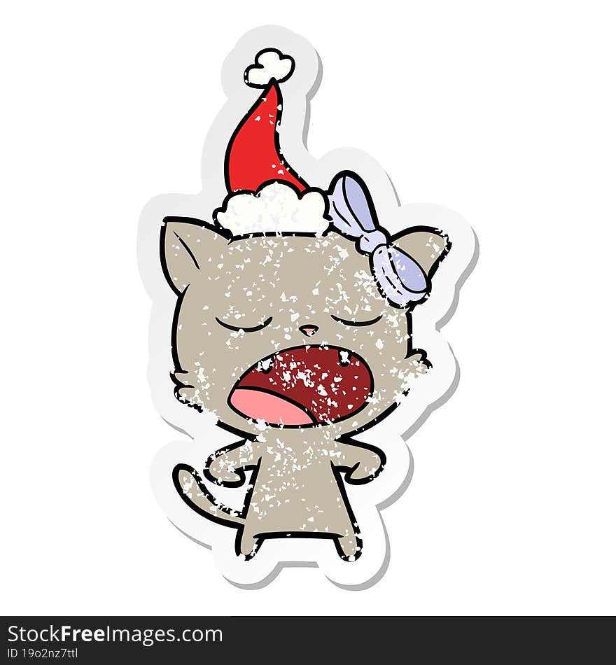 distressed sticker cartoon of a yawning cat wearing santa hat