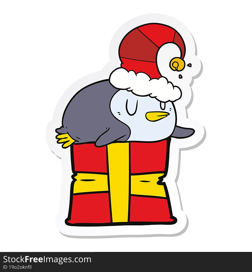 sticker of a cartoon penguin wearing christmas hat