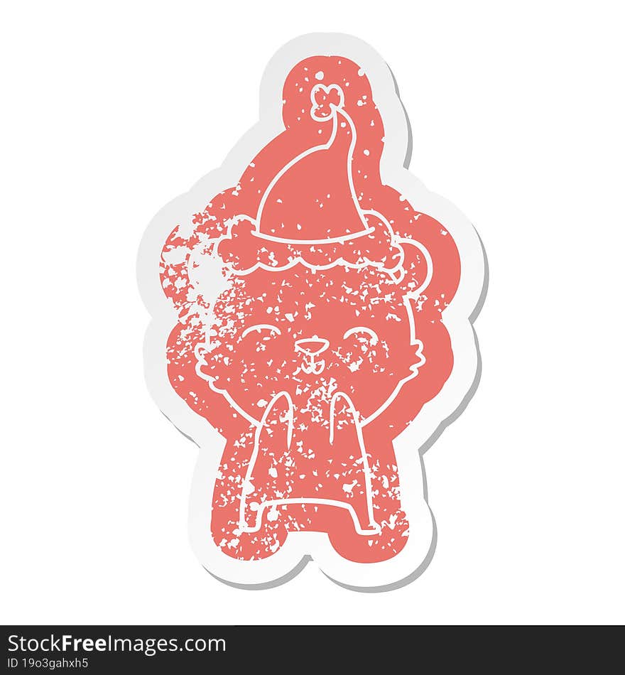 happy cartoon distressed sticker of a polar bear wearing santa hat