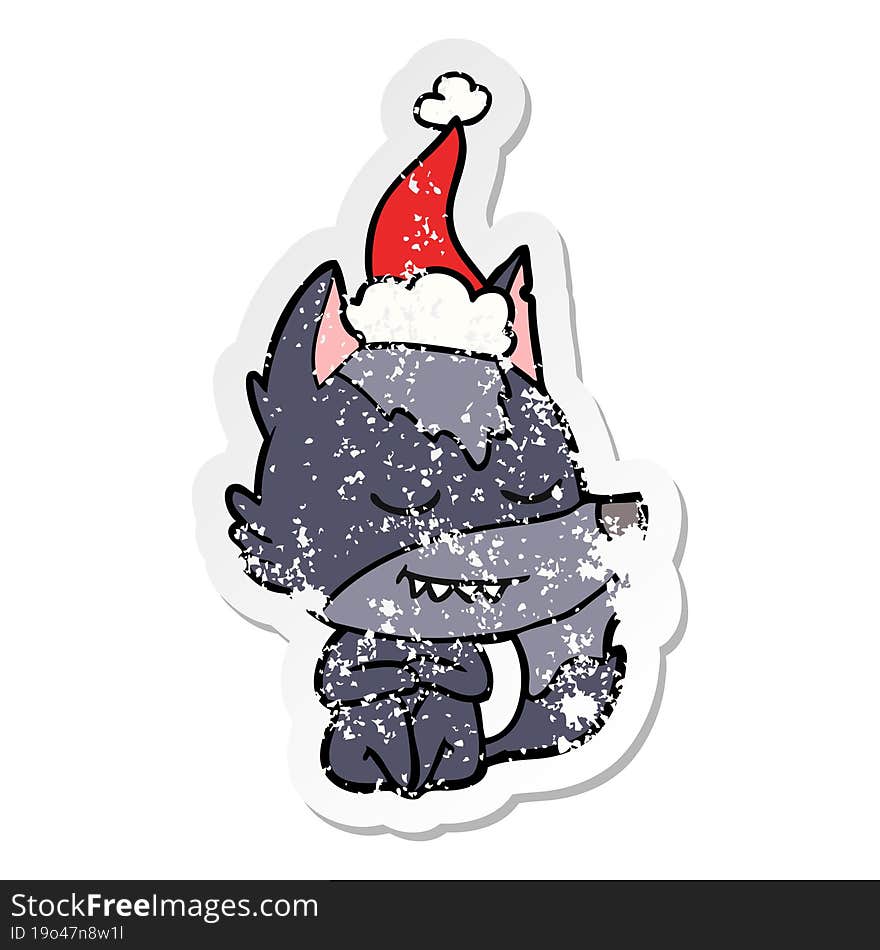 friendly distressed sticker cartoon of a wolf sitting wearing santa hat