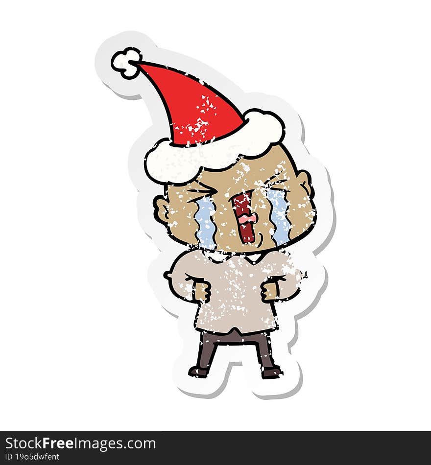 Distressed Sticker Cartoon Of A Crying Bald Man Wearing Santa Hat