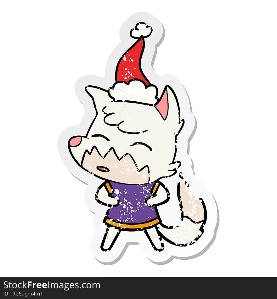 distressed sticker cartoon of a fox wearing santa hat