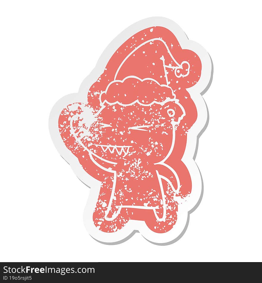 angry polar bear cartoon distressed sticker of a wearing santa hat