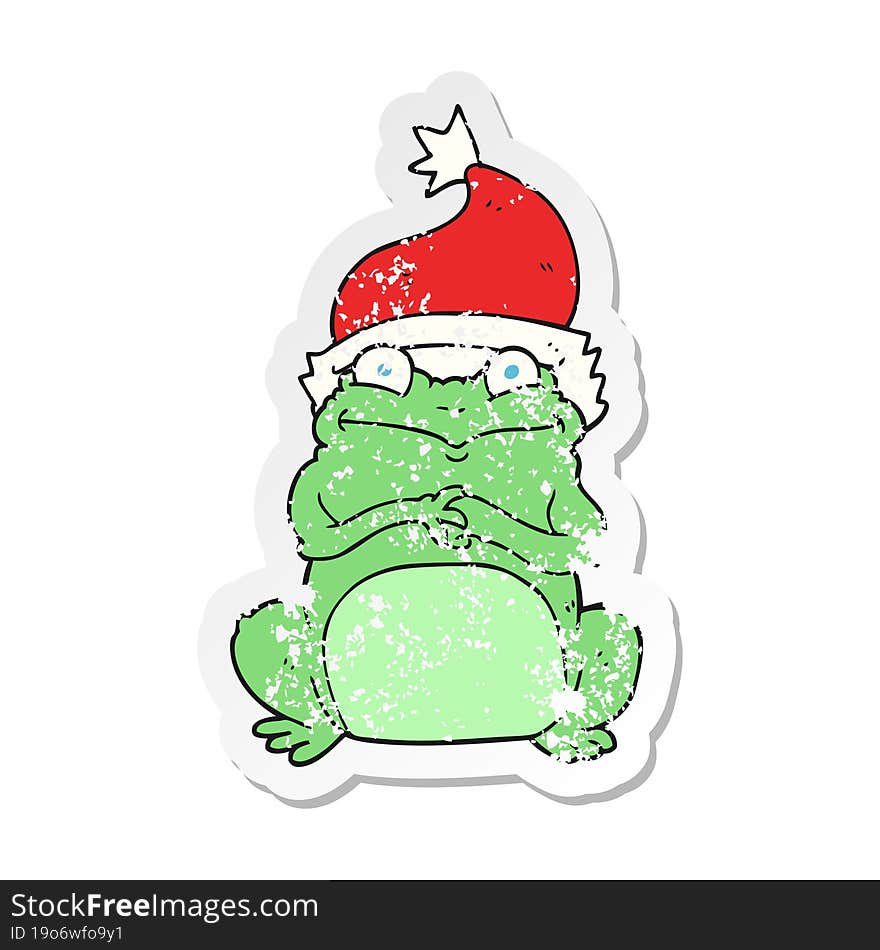 retro distressed sticker of a cartoon frog wearing christmas hat