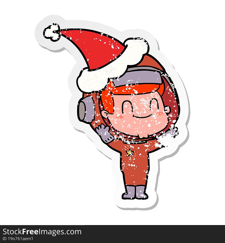 happy distressed sticker cartoon of a astronaut man wearing santa hat