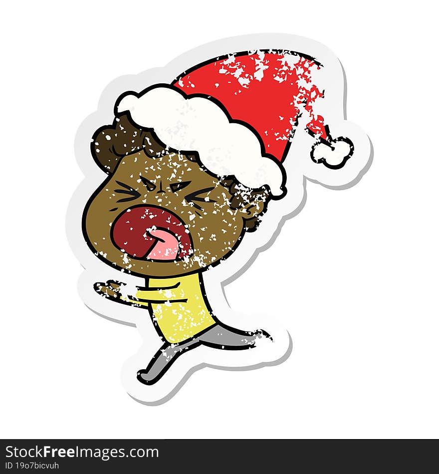 distressed sticker cartoon of a furious man wearing santa hat