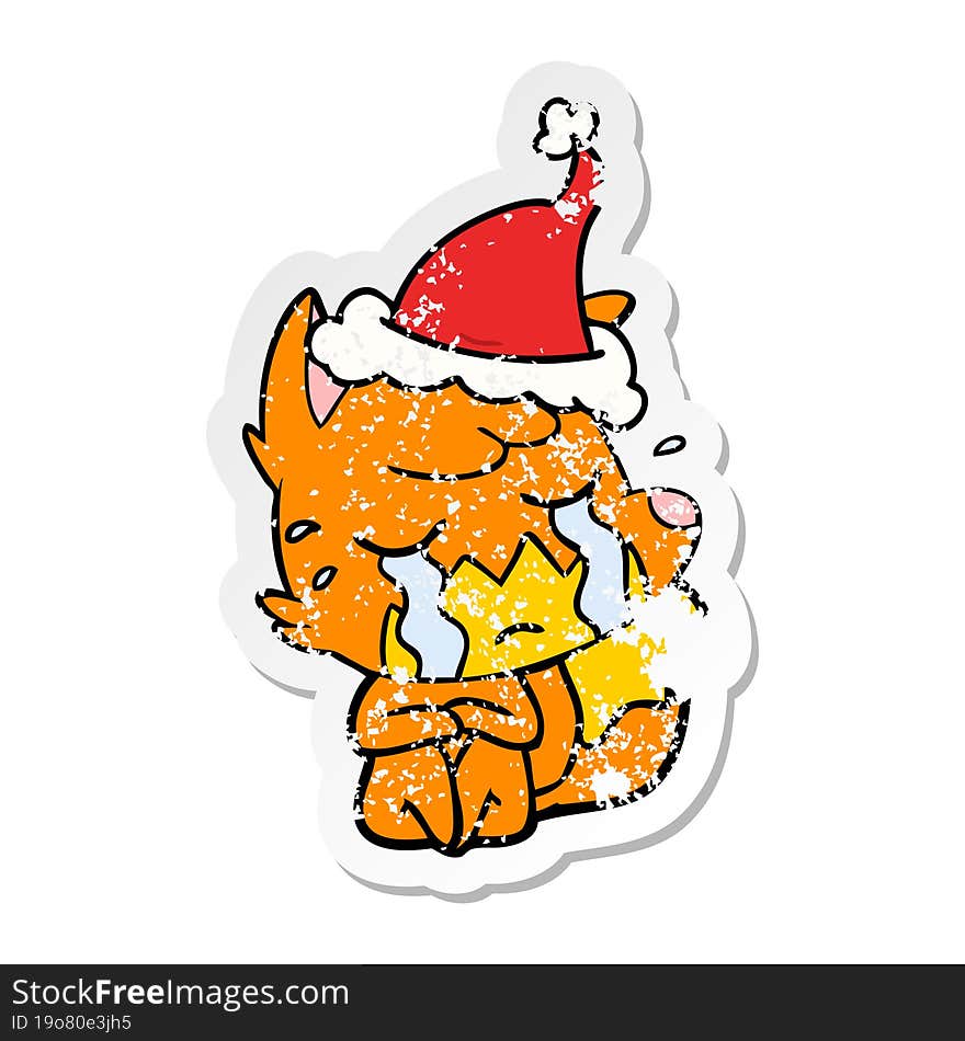 crying fox hand drawn distressed sticker cartoon of a wearing santa hat. crying fox hand drawn distressed sticker cartoon of a wearing santa hat