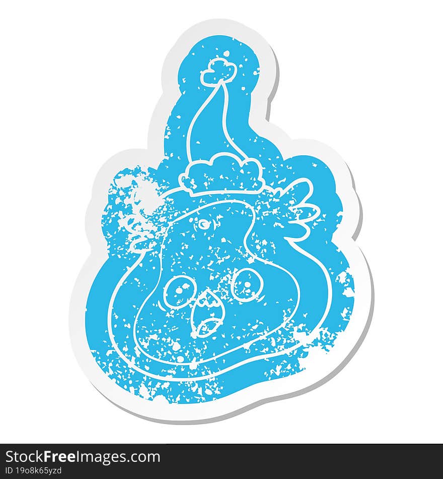 Cartoon Distressed Sticker Of A Germ Wearing Santa Hat