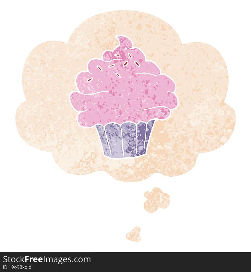 cartoon cupcake with thought bubble in grunge distressed retro textured style. cartoon cupcake with thought bubble in grunge distressed retro textured style