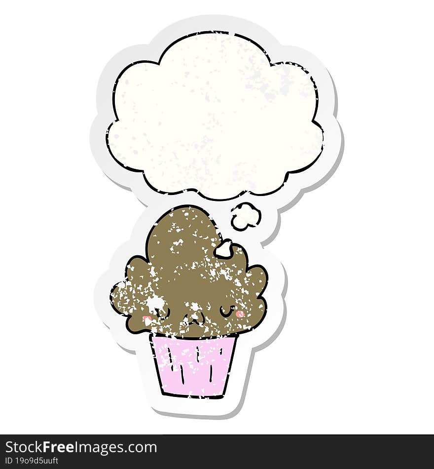 cartoon cupcake with face and thought bubble as a distressed worn sticker