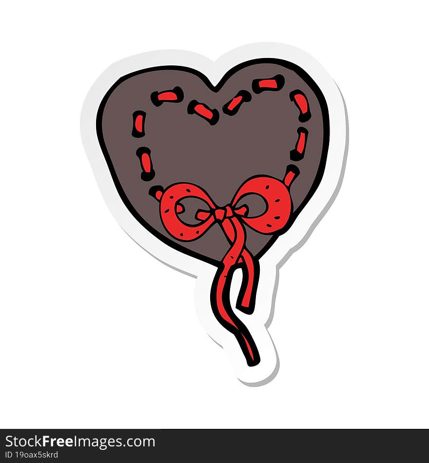 sticker of a stitched heart cartoon