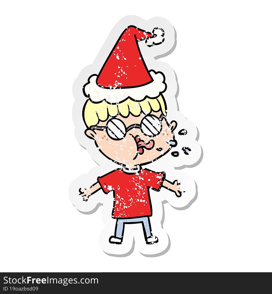 Distressed Sticker Cartoon Of A Boy Wearing Spectacles Wearing Santa Hat