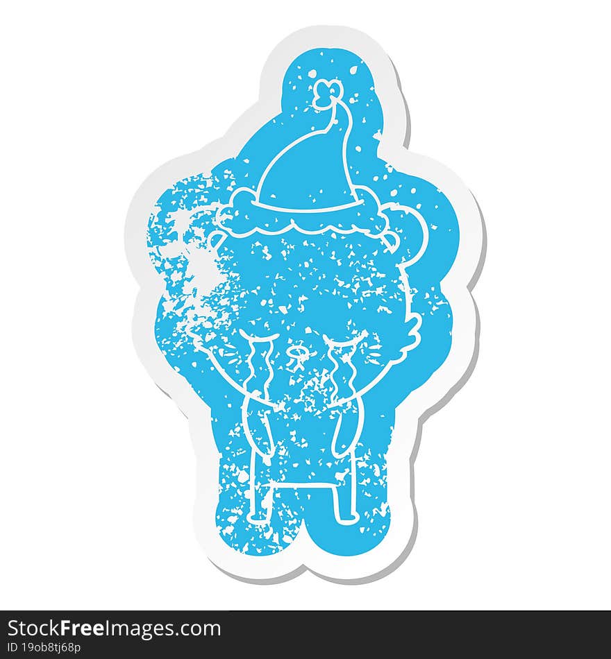 crying cartoon distressed sticker of a bear wearing santa hat