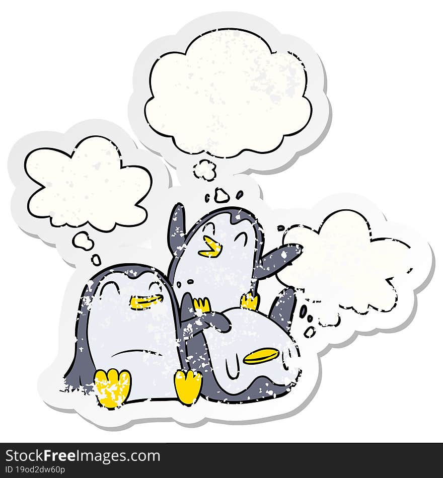 cartoon penguins and thought bubble as a distressed worn sticker