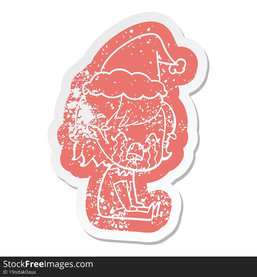 cartoon distressed sticker of a crying vampire girl wearing santa hat