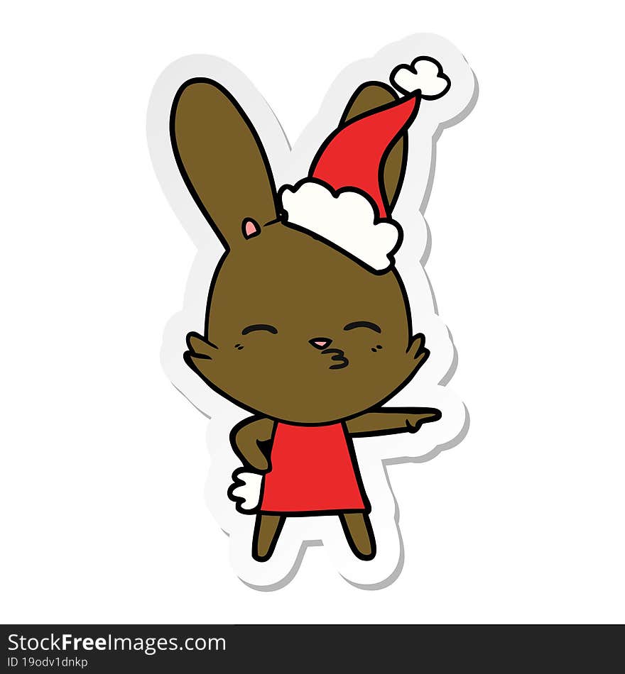 curious bunny sticker cartoon of a wearing santa hat