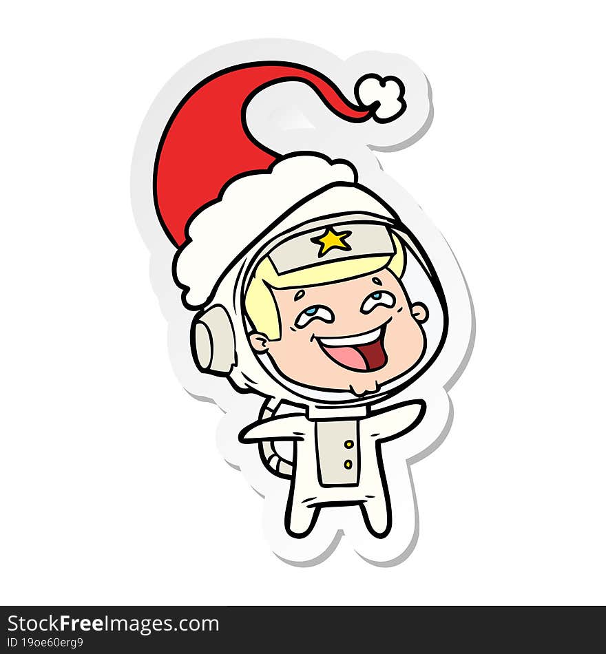 sticker cartoon of a laughing astronaut wearing santa hat