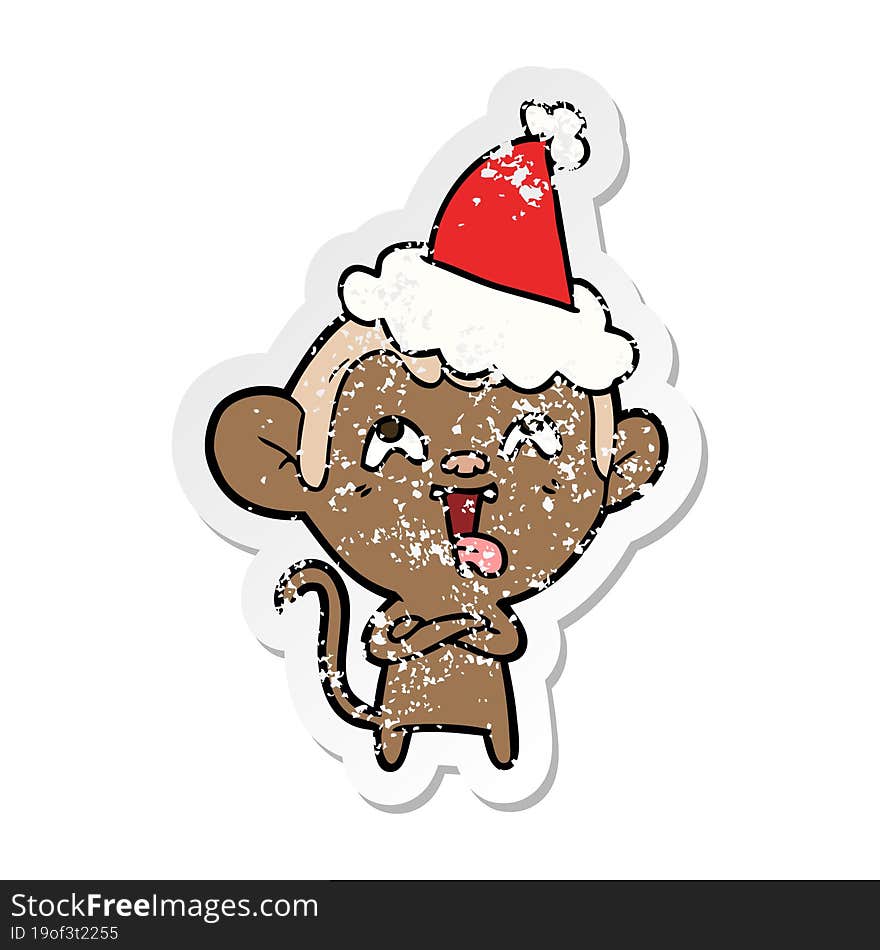 crazy distressed sticker cartoon of a monkey wearing santa hat