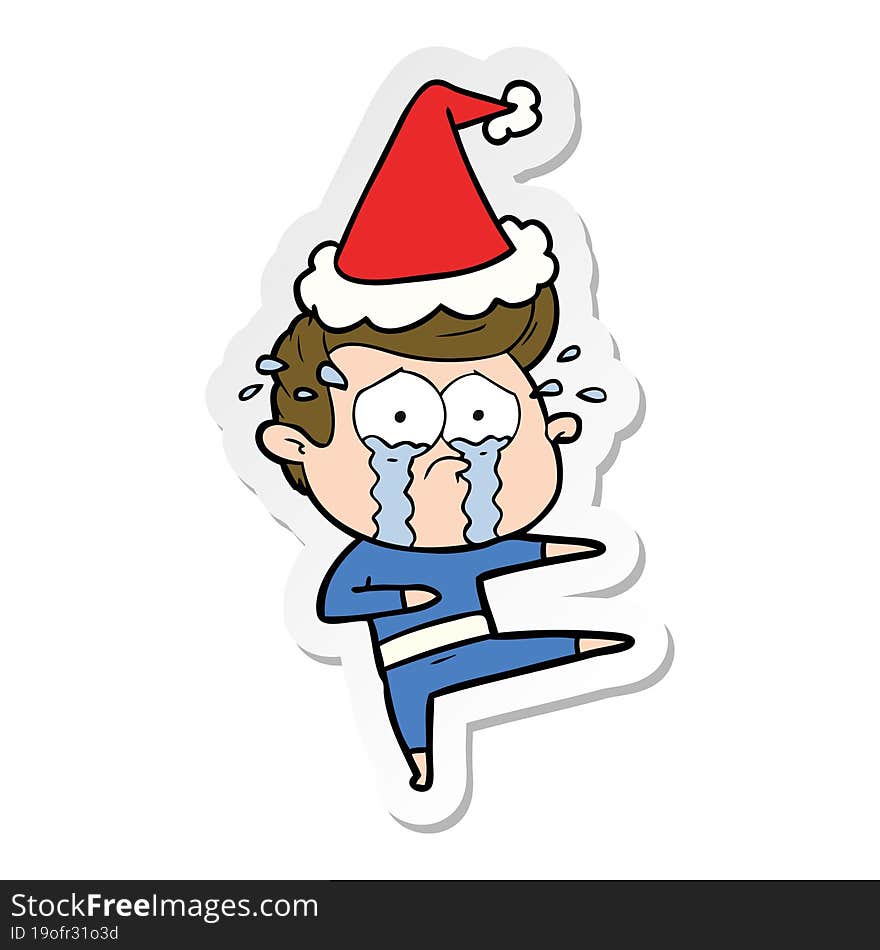 hand drawn sticker cartoon of a crying dancer wearing santa hat