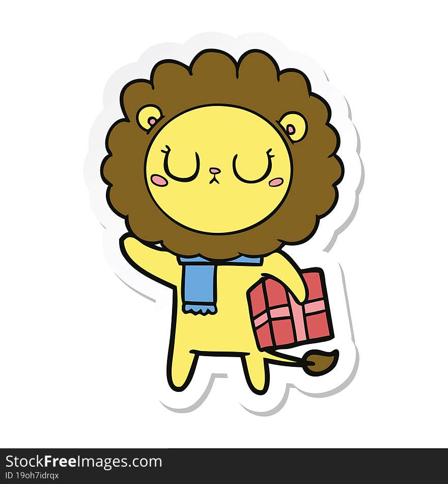 sticker of a cartoon lion with christmas present