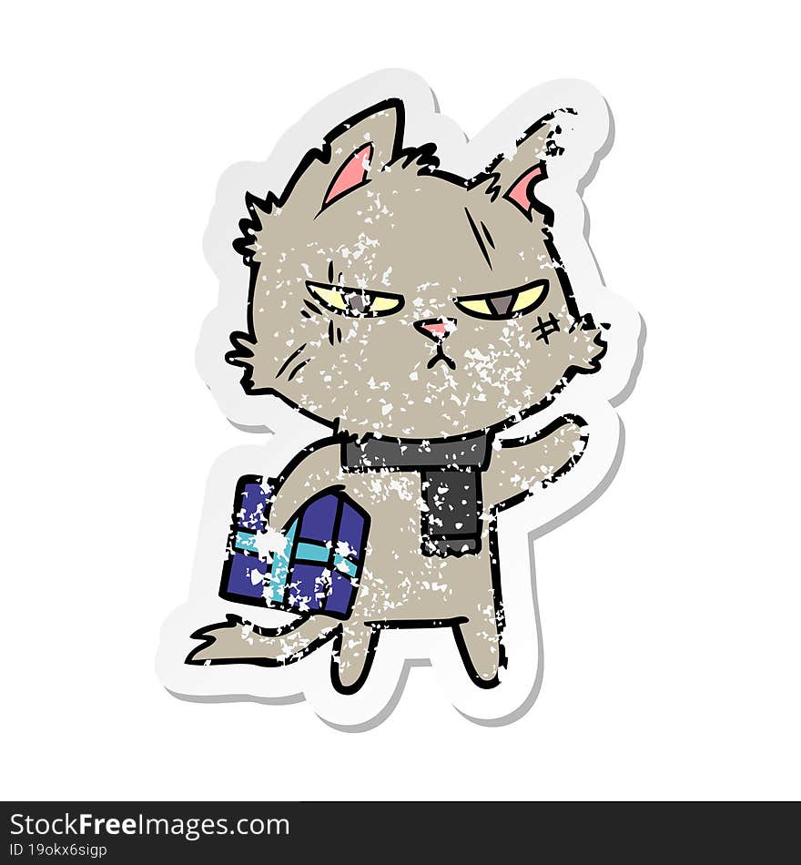 distressed sticker of a tough cartoon cat with christmas present