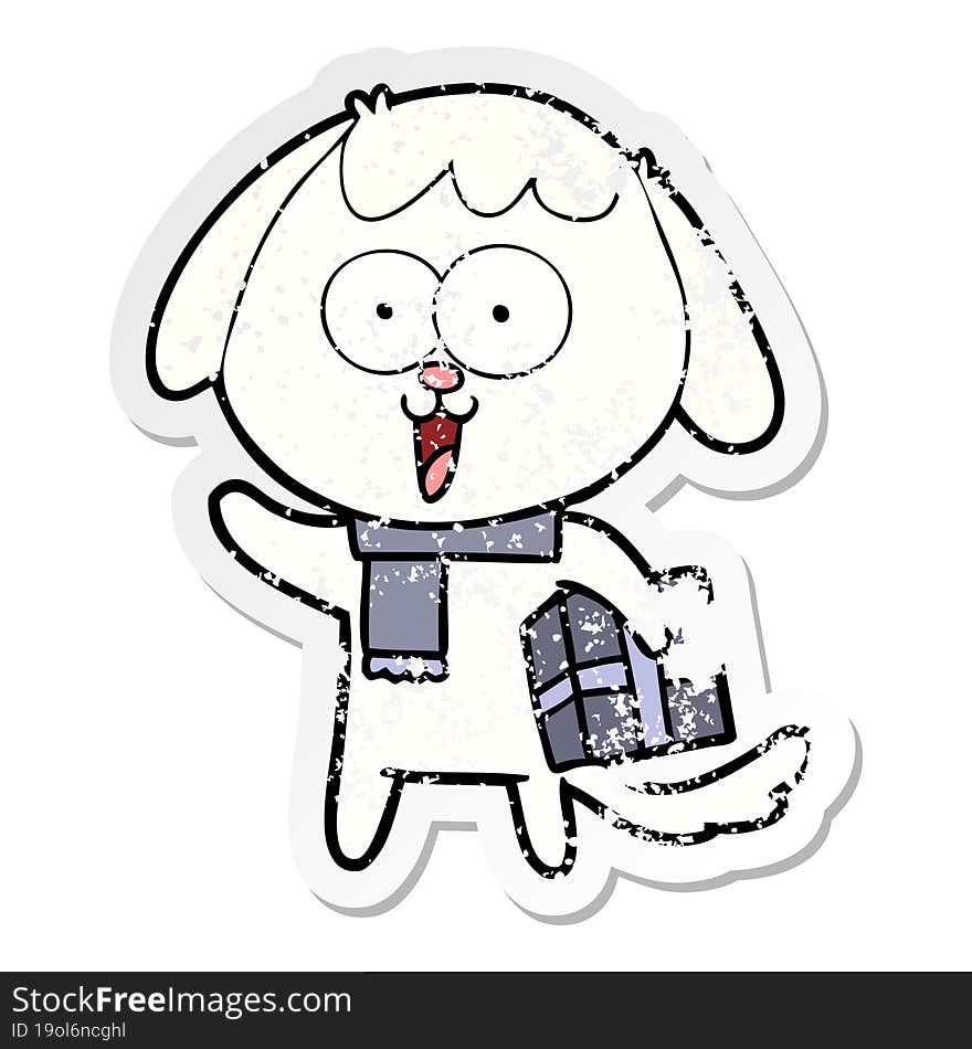 distressed sticker of a cute cartoon dog with christmas present