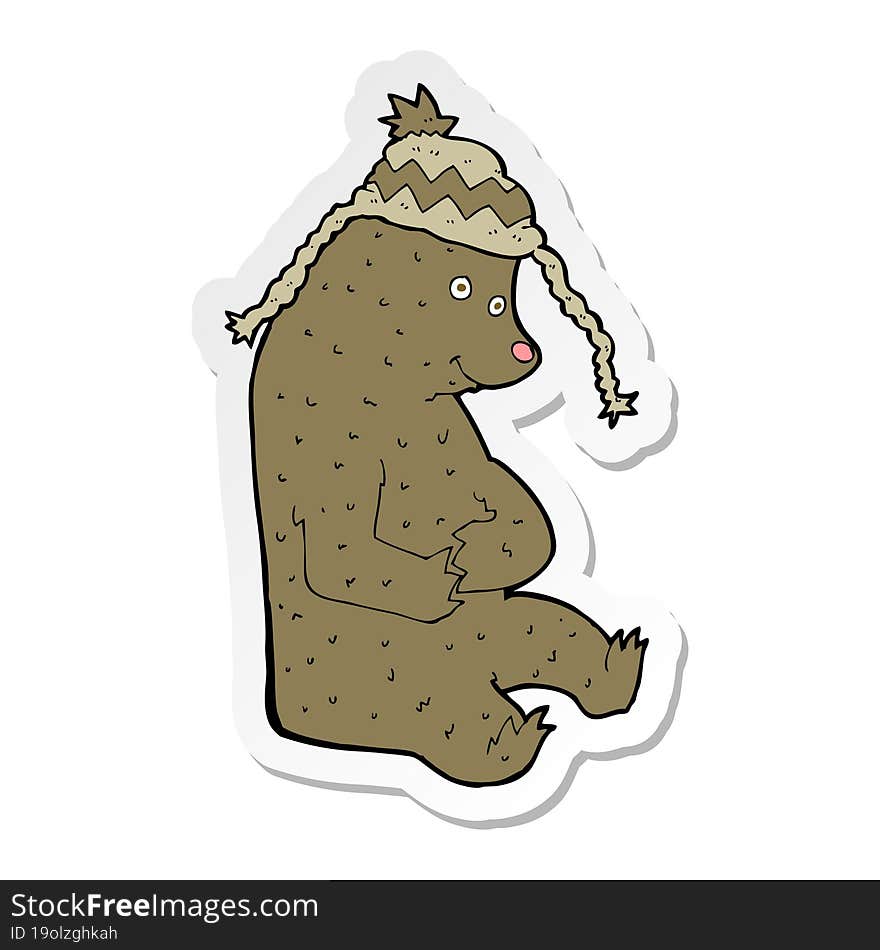 sticker of a cartoon bear in winter hat