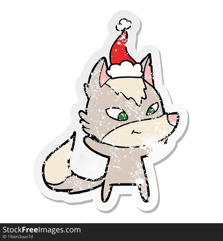 friendly distressed sticker cartoon of a wolf wearing santa hat