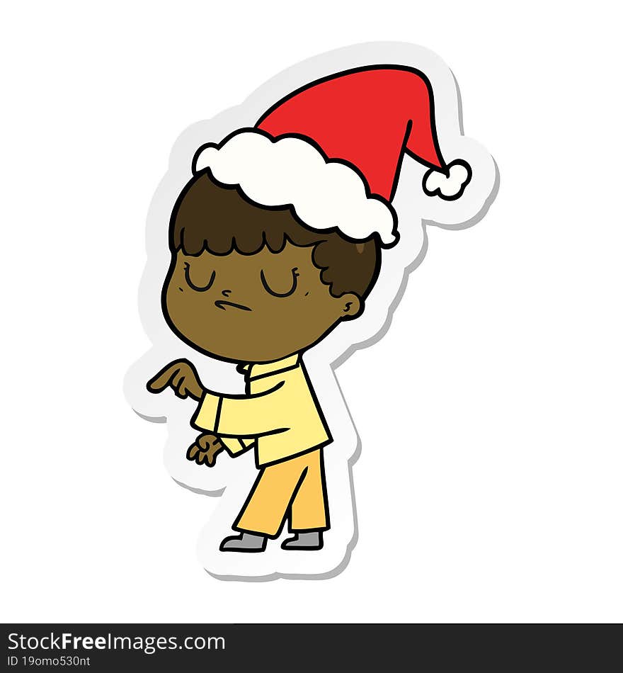 sticker cartoon of a grumpy boy wearing santa hat