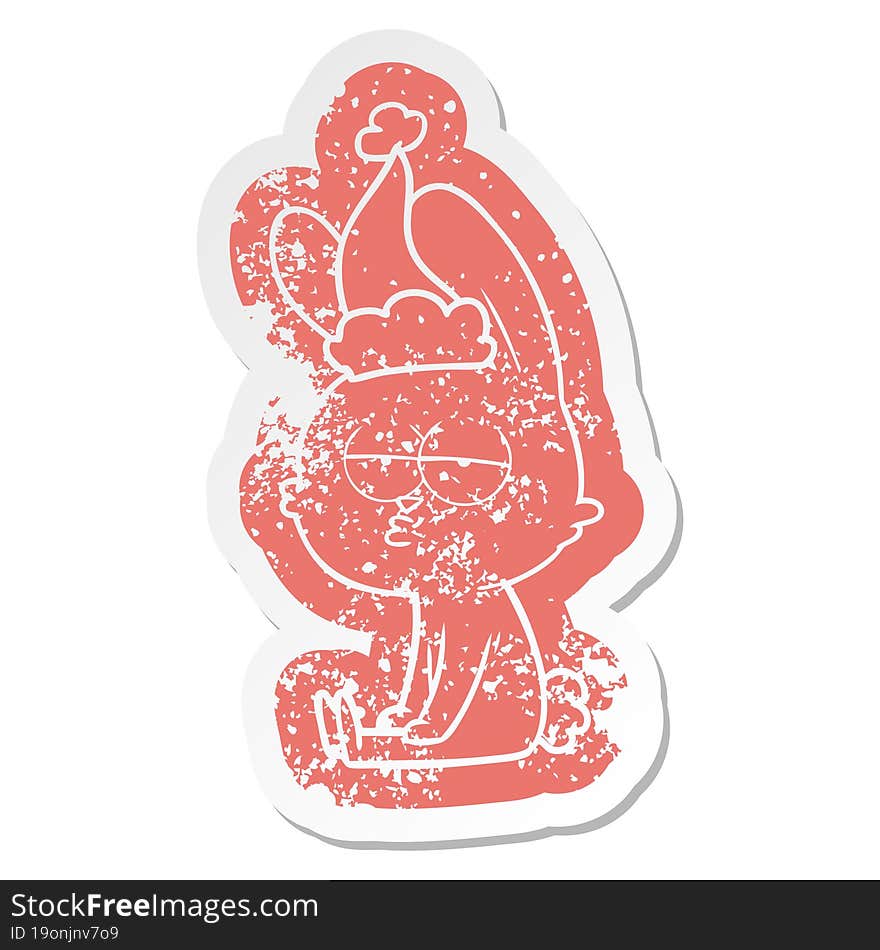 cute quirky cartoon distressed sticker of a rabbit wearing santa hat