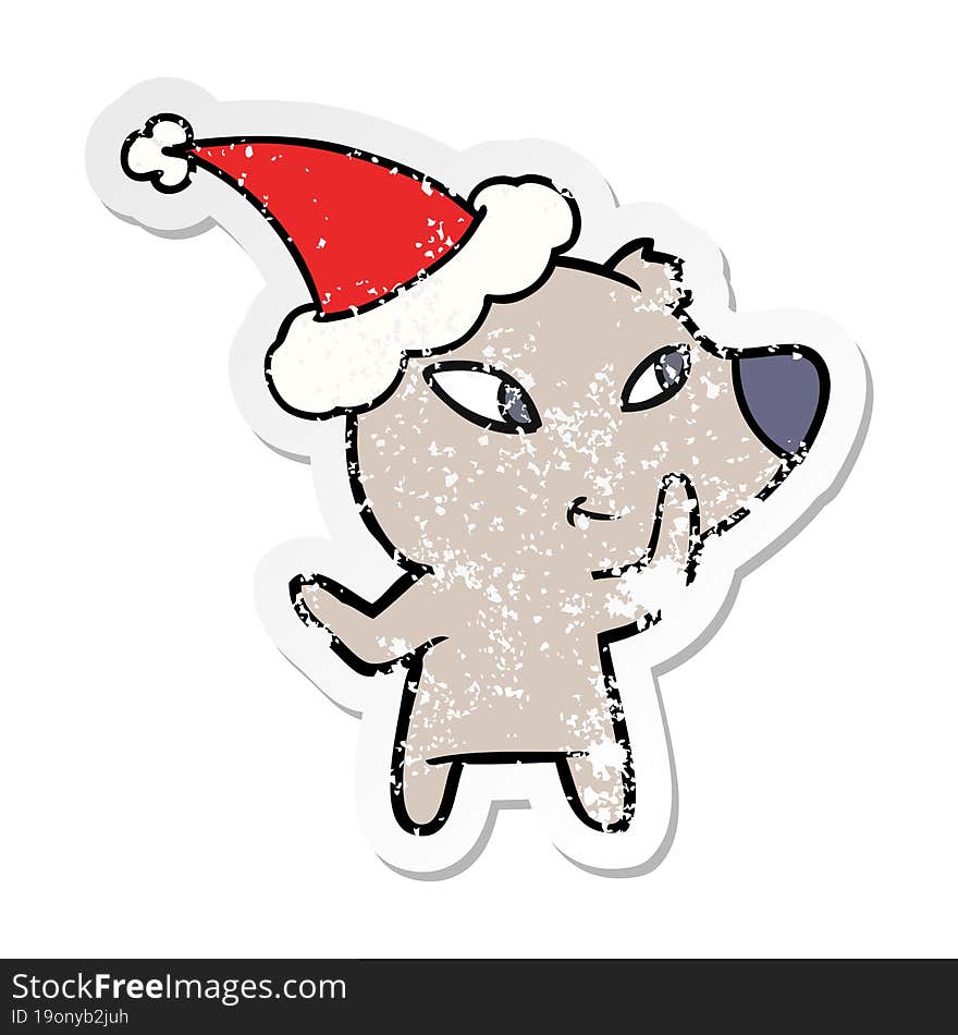 cute distressed sticker cartoon of a bear wearing santa hat