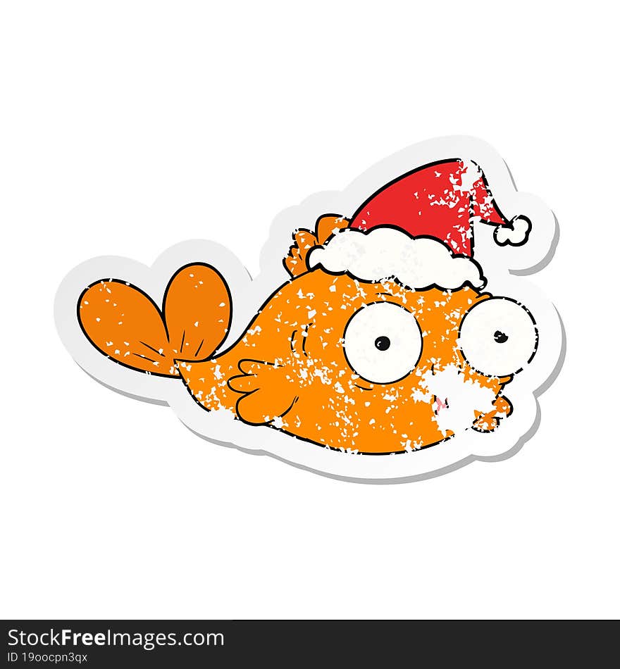 happy goldfish distressed sticker cartoon of a wearing santa hat