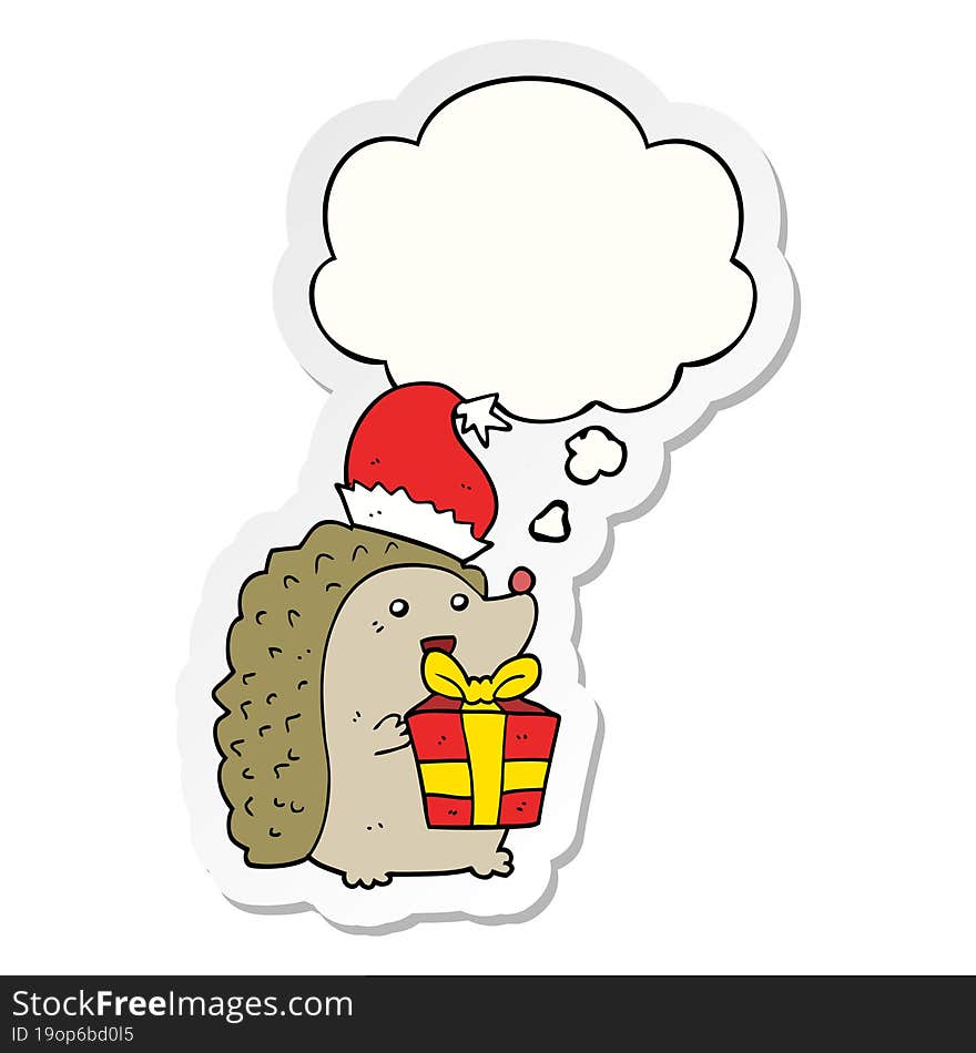 cartoon hedgehog wearing christmas hat and thought bubble as a printed sticker