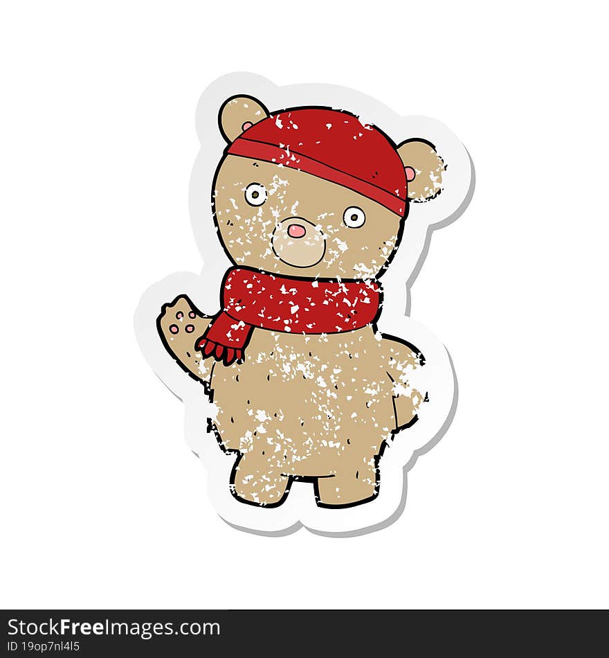 Retro Distressed Sticker Of A Cartoon Teddy Bear In Winter Hat And Scarf