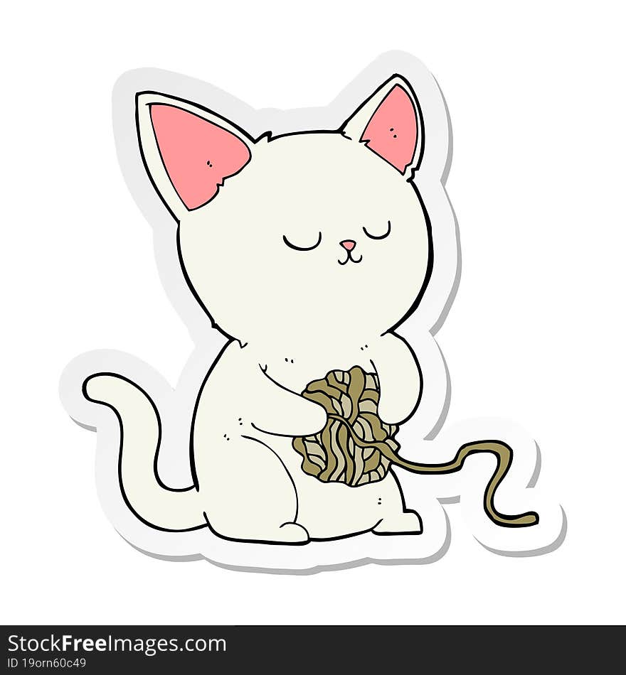 sticker of a cartoon cat playing with ball of yarn