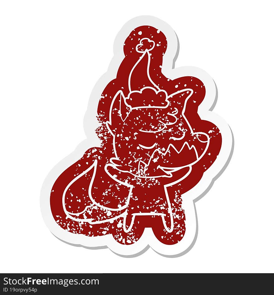 Friendly Cartoon Distressed Sticker Of A Fox Wearing Santa Hat