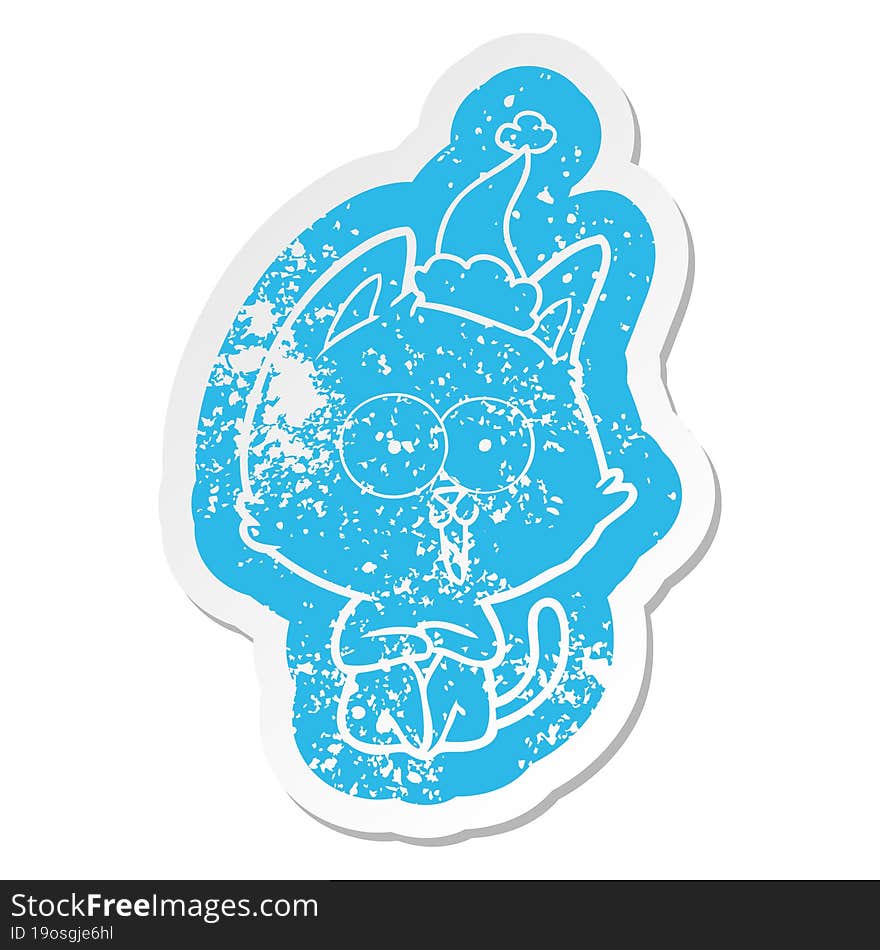 funny quirky cartoon distressed sticker of a cat wearing santa hat