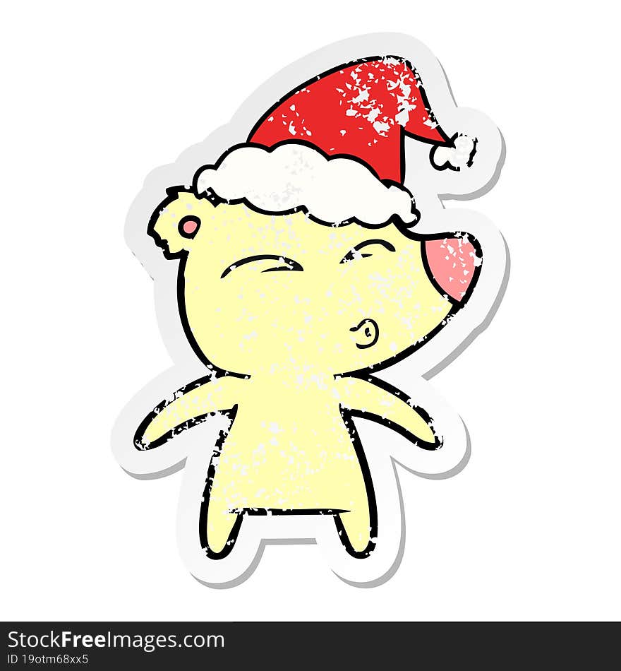 distressed sticker cartoon of a whistling bear wearing santa hat